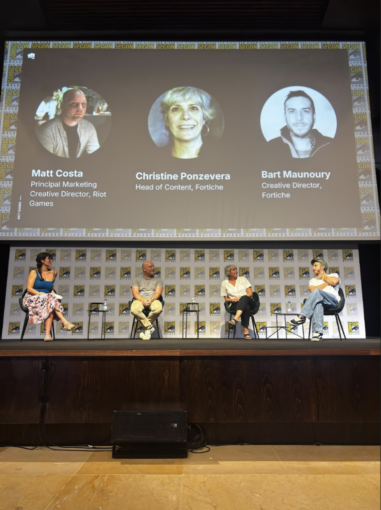 Matt Costa (Riot Games), Christine Ponzevera, and Bart Maunoury (Fortiche) speaking of Arcane on a panel at Comic Con Malaga.