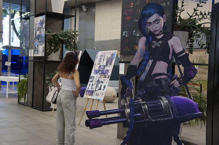 Life-sized Jinx cutout and character concept art at the Arcane exhibition by animation production company Fortiche